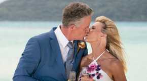The Golden Bachelorette's Chock Chapple And Joan Vassos Kissing With Champagne Glasses After Engagement