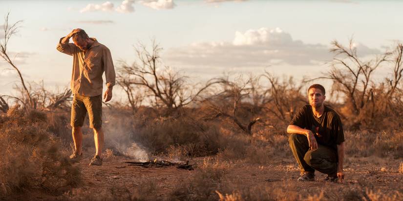 Eric (Guy Pearce) And Rey (Robert Pattinson) looking dejected in the Australian Outback in The Rover.