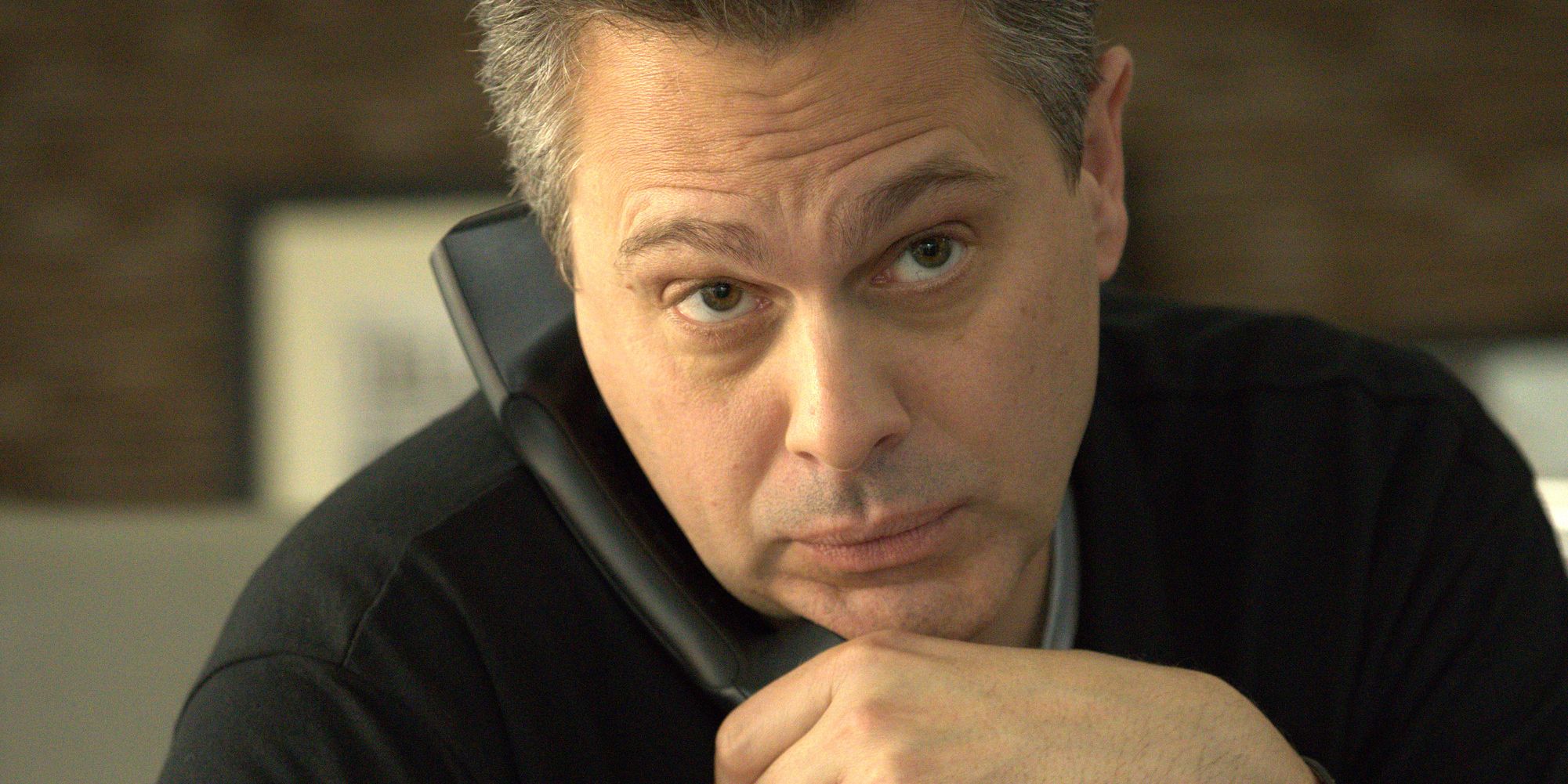 Thomas Sadoski as Brian Murphy on the phone in American Sports Story