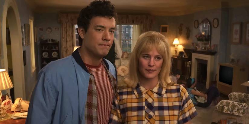 Tom Hanks and Robin Wright stand together in Here 2024