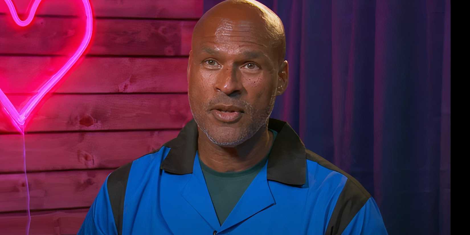 the golden bachelorette Jonathan Rone in a confessional with a neon pink balloon in the background