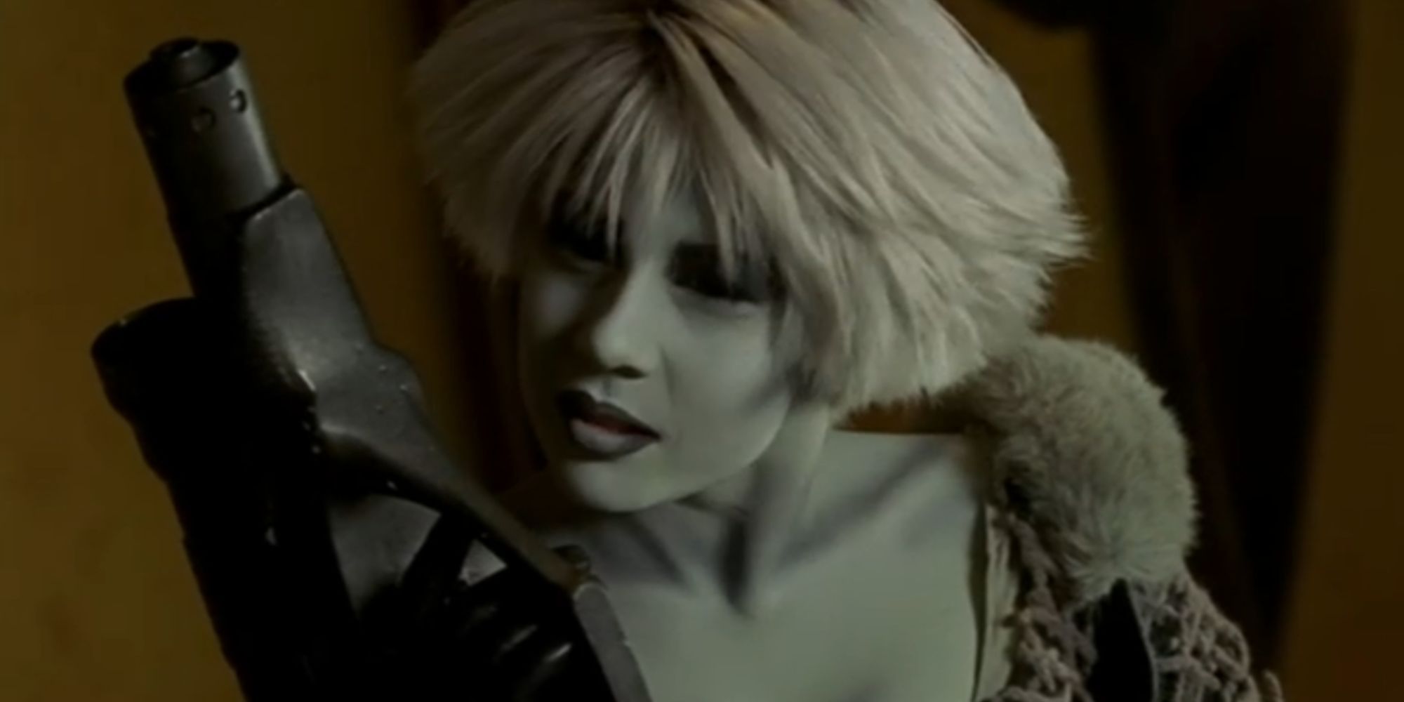 Gigi Edgley holding a weapon and looking serious as Chiana in Farscape