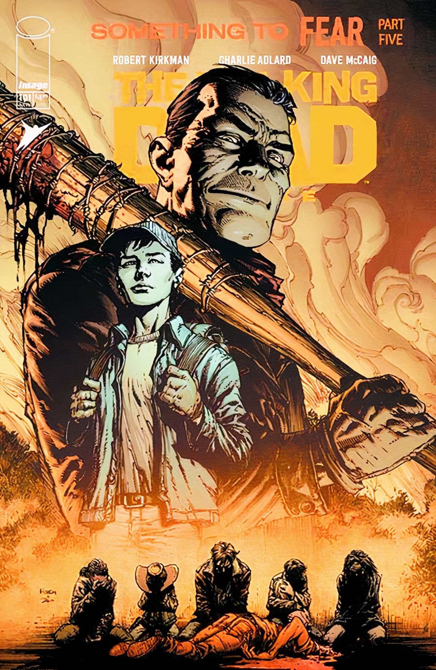 Comic book cover: Negan looming over Glenn, as the survivors kneel at his mercy