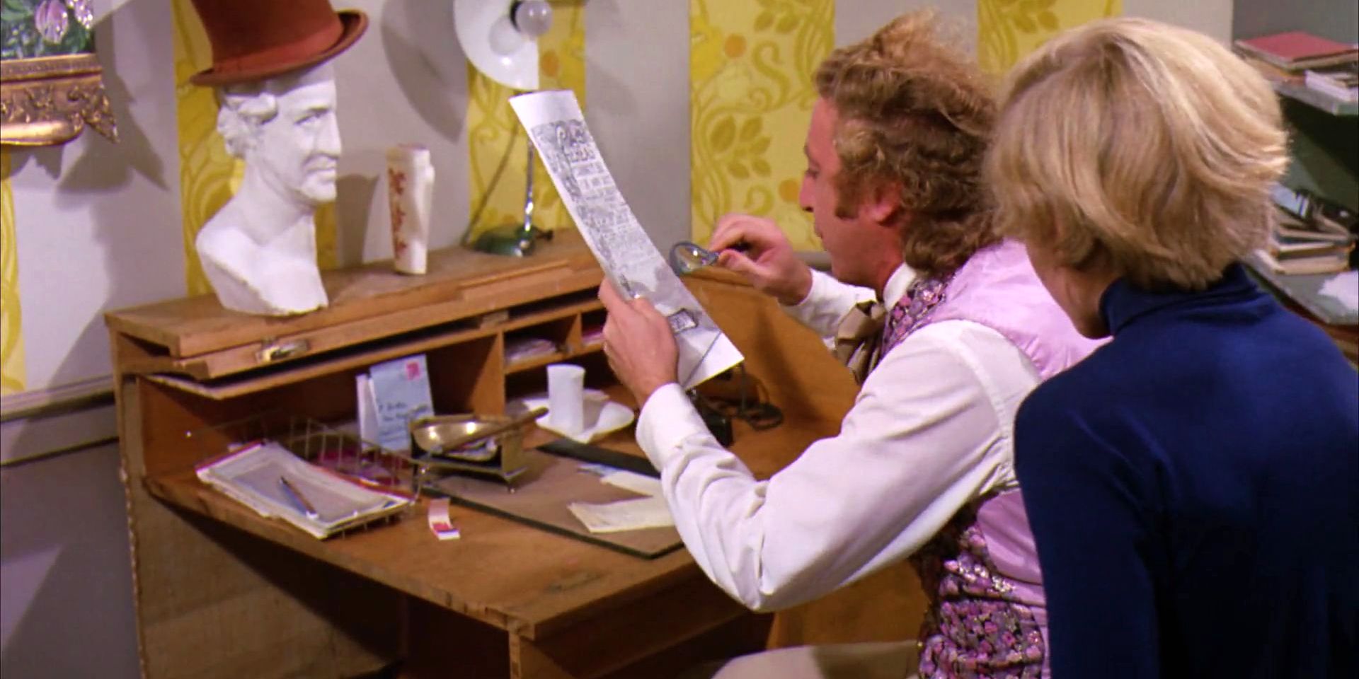 Willy Wonka reading a contract to Charlie with a magnifying glass