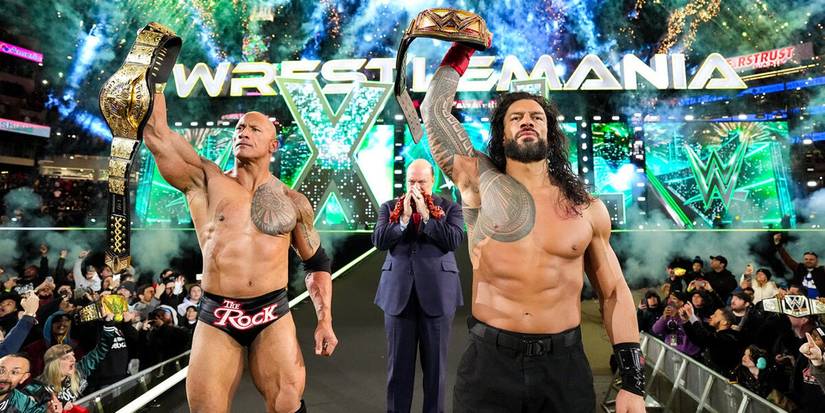 WWE Undisputed Universal Heavyweight Champion Roman Reigns and The Rock pose at the top of the WrestleMania XL ramp in between Paul Heyman