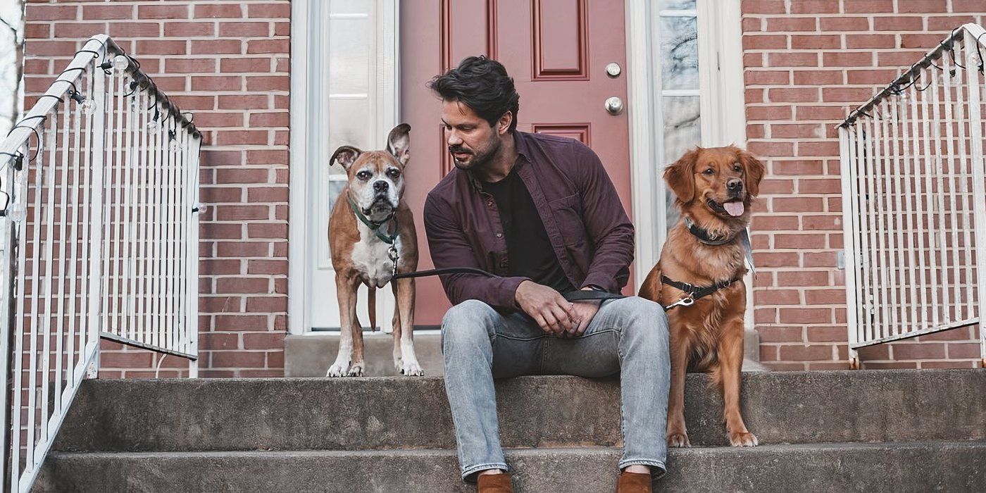 Married At First Sight season 10 Zach Justice with his two dogs setaed on a stoop