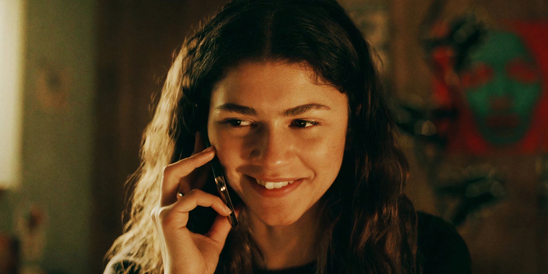 Zendaya as Rue looking happy while talking on the phone in Euphoria