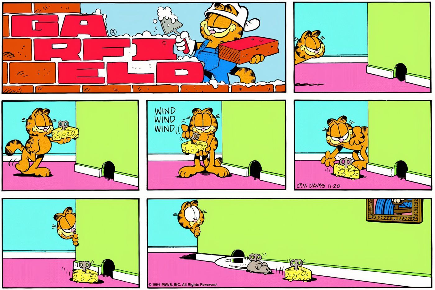 Garfield trying to catch a mouse with toy cheese.