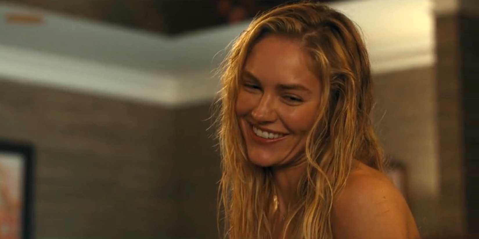 Ainsley (Michelle Randolph) smiling with her hair wet in Landman season 1, episode 8