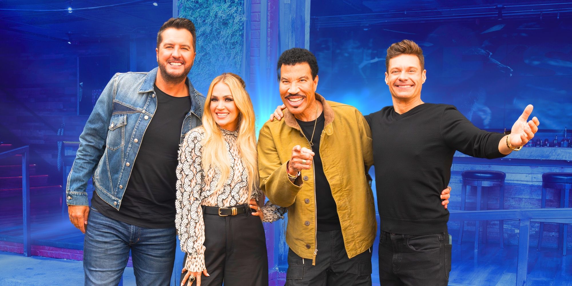 American Idol's Luke Bryan, Carrie Underwood, Lionel Richie and Ryan Seacrest smile while posing with each other.