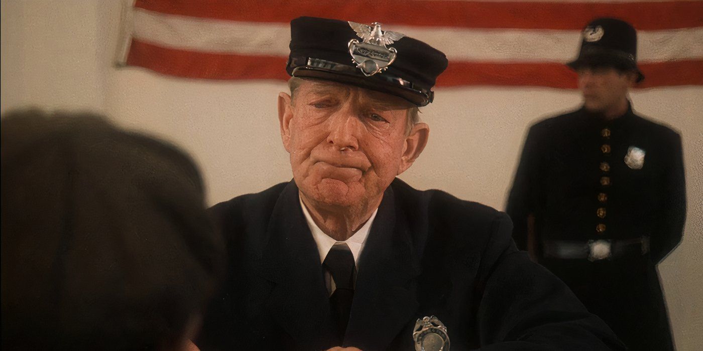 An immigration worker looking at young Vito in The Godfather