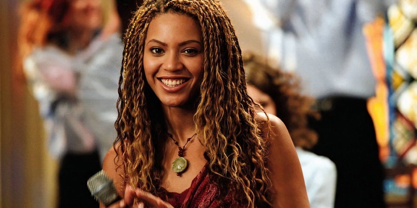 Beyonce smiling at the camera in The Fighting Temptations