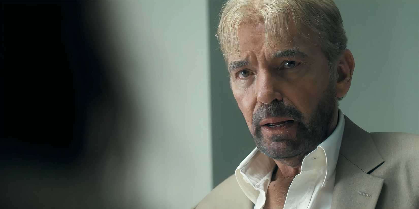 Billy Bob Thornton as Tommy looking worriedly at Paulina Chávez's Ariana in the hospital in Landman episode 6