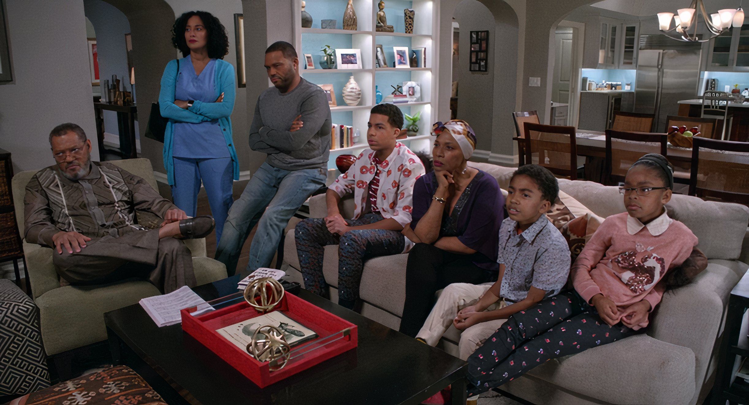 Pops, Bow, Dre, and Ruby sit around couch