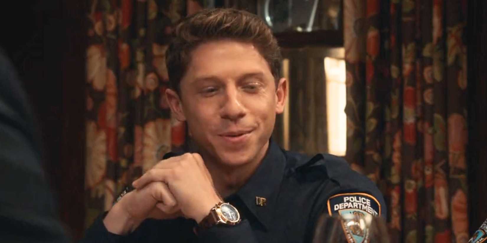 Blue Bloods Joe Hill sitting at the family dinner table in his police uniform