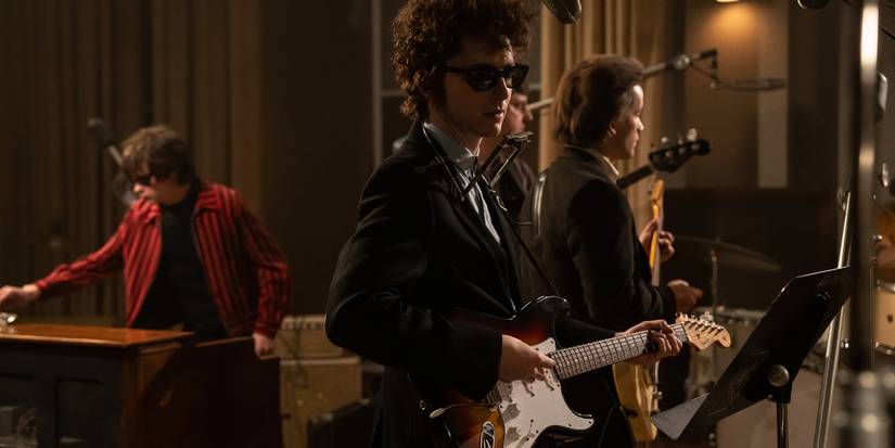 Bob Dylan plays with his band in A Complete Unknown