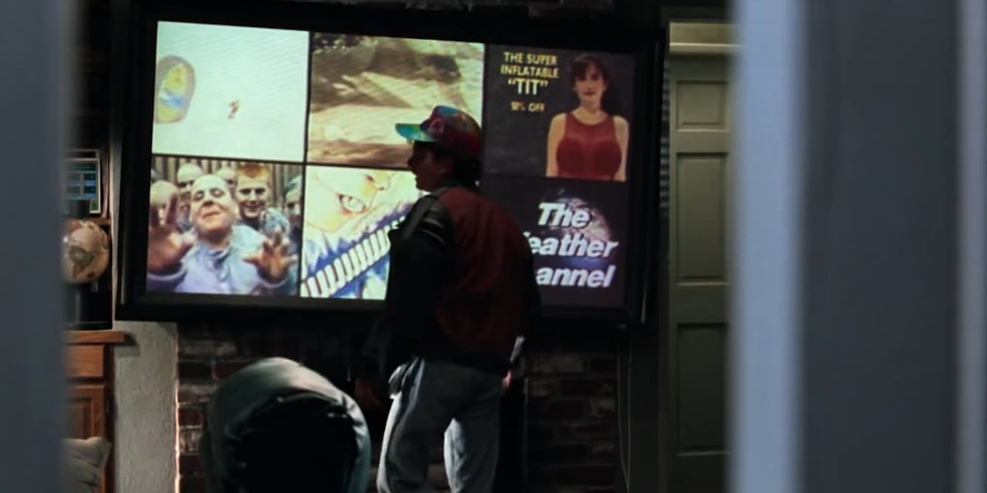 Marty McFly Jr. (Michael J. Fox) watches six TV channels at once, one of which displays an advertisement for "The super inflatable 'TIT'" in Back to the Future Part II