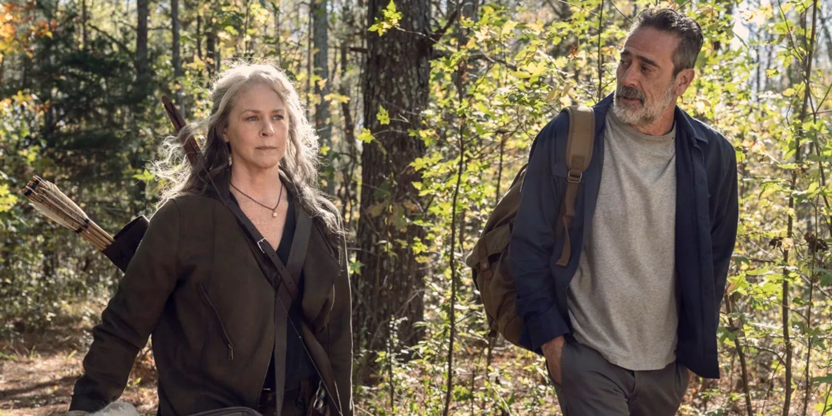 Carol and Negan walk through the woods in The Walking Dead