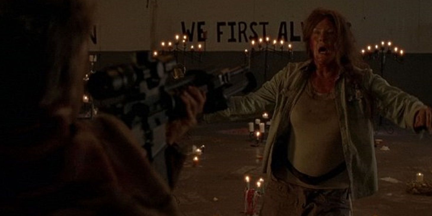 Carol holds Mary at gunpoint in The Walking Dead