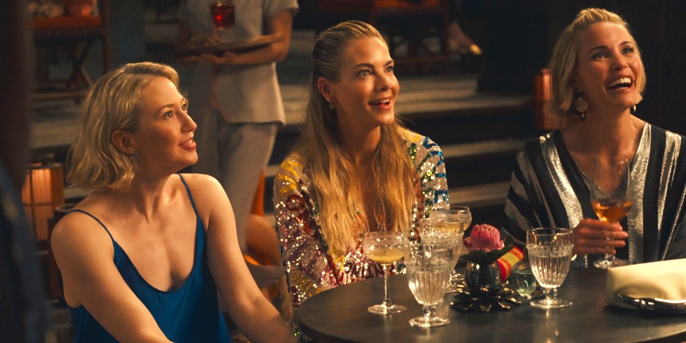 Carrie Coon, Michelle Monaghan and Leslie Bibb sip cocktails at a table in season 3 of The White Lotus