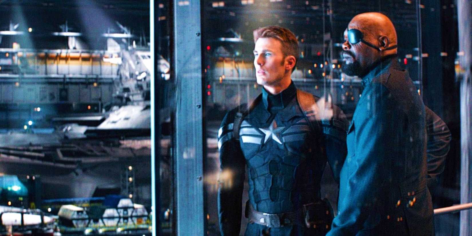 Chris Evans As Steve Rogers And Samuel L Jackson As Nick Fury In Elevator Overlooking Project Oversight In Captain America The Winter Soldier