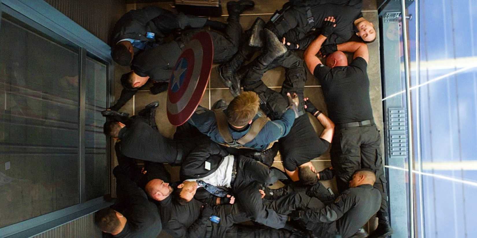 Chris Evans As Steve Rogers In An Elevator Surrounded By Subdued Hydra Agents In Captain America The Winter Soldier
