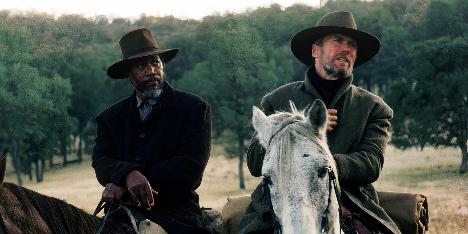 Clint Eastwood and Morgan Freeman on horses in Unforgiven