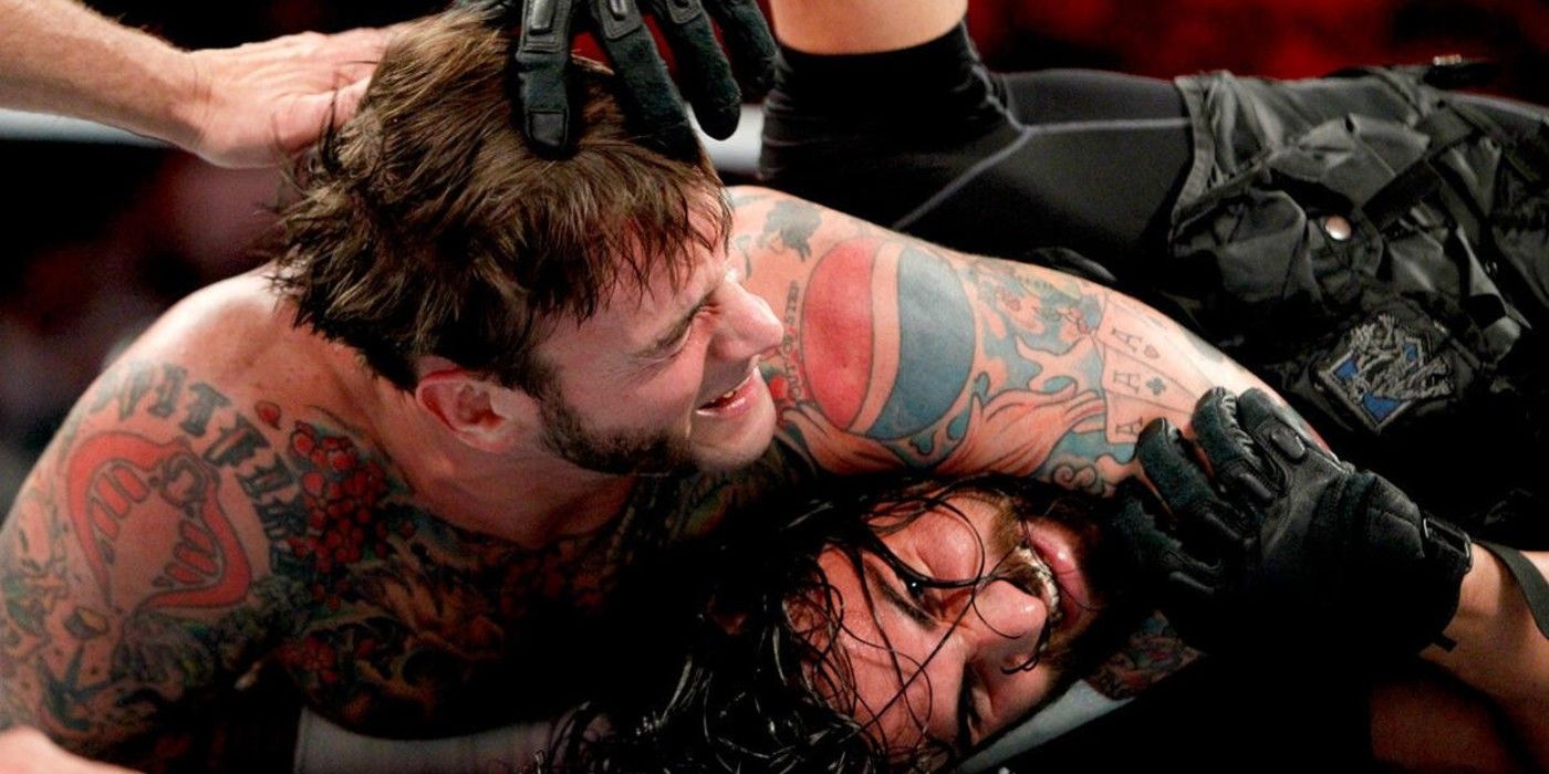CM Punk has Seth Rollins of The Shield in a sleeper hold on the December 30 2013 episode of WWE Monday Night Raw