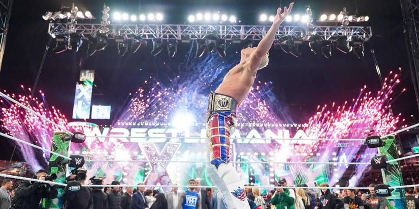 Cody Rhodes celebrates winning the WWE Championship with pyro at WrestleMania 40