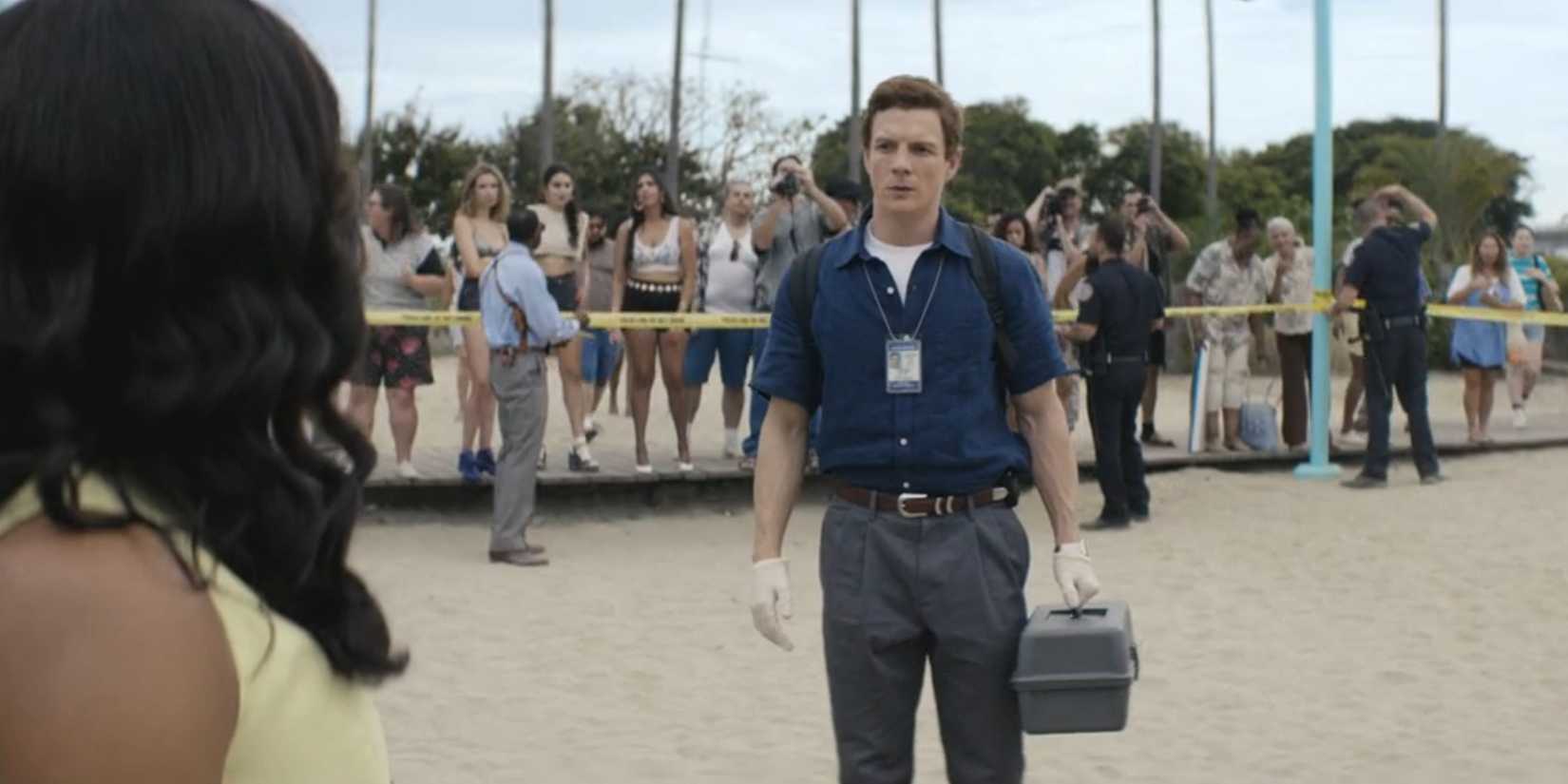 Dexter Morgan (Patrick Gibson) standing awkwardly at a crime scene in Dexter: Original Sin season 1, episode 4