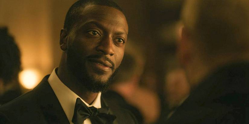 Alex (Aldis Hodge) meets Ed Ramsey at a gala in Cross Season 1