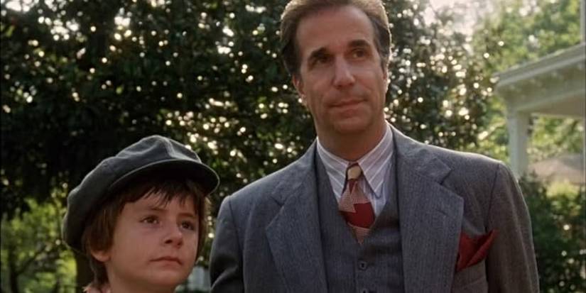 Dad (Henry Winkler) and Buddy (T.J. Lowther) smiling together in One Christmas.