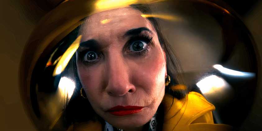 Demi Moore's Elisabeth looking insanely into a reflection in The Substance