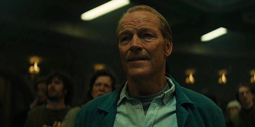 Dr. Pete Nichols (Iain Glen) smiling and crying in Silo season 1, episode 10