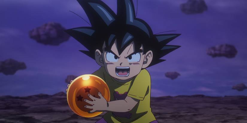 Goku holding the Dragon Ball after recovering it.