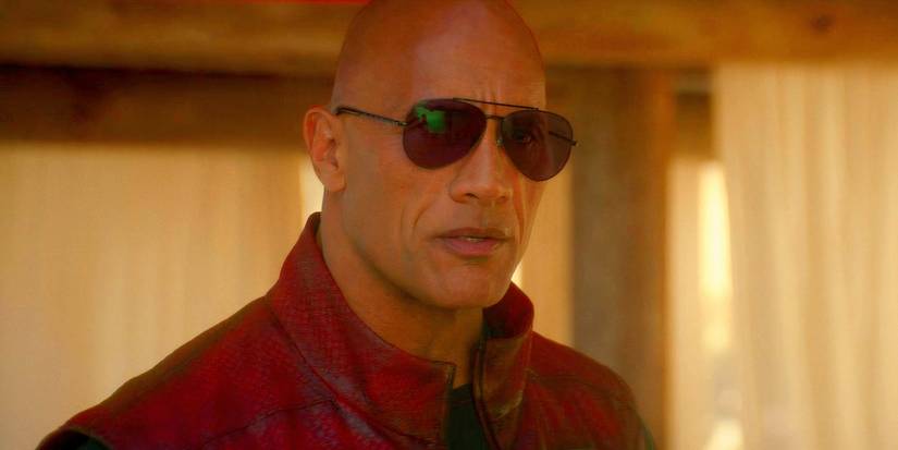 Dwayne Johnson as Callum Drift wearing sunglasses in Red One