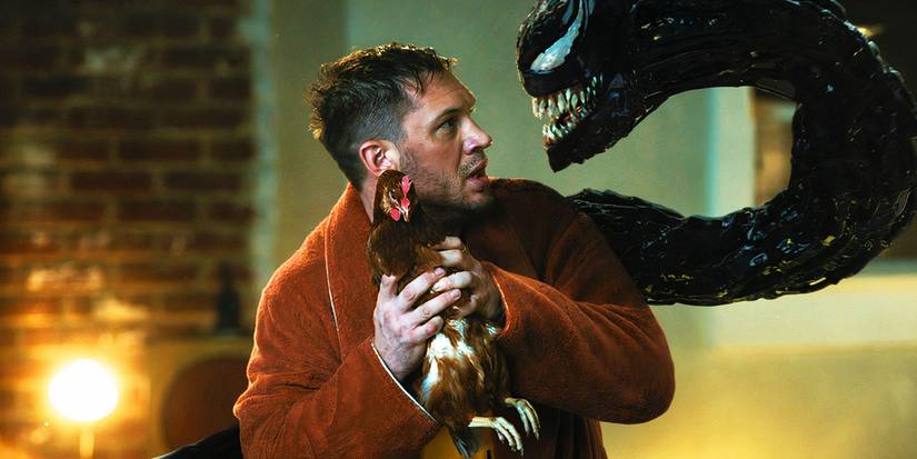 Eddie Brock and Venom with a chicken in Venom Let There Be Carnage