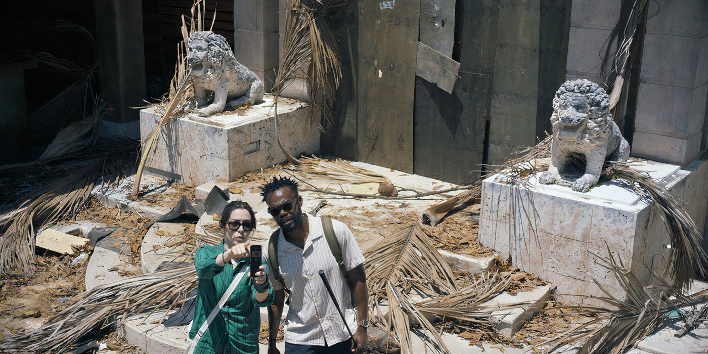 Emma and Noah standing in rubble in the Resort