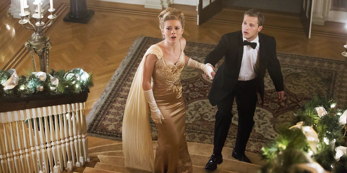 Flowers In The Attic 2 - Petals On The Wind - Rose McIver in a gold dress with a man in a tuxedo