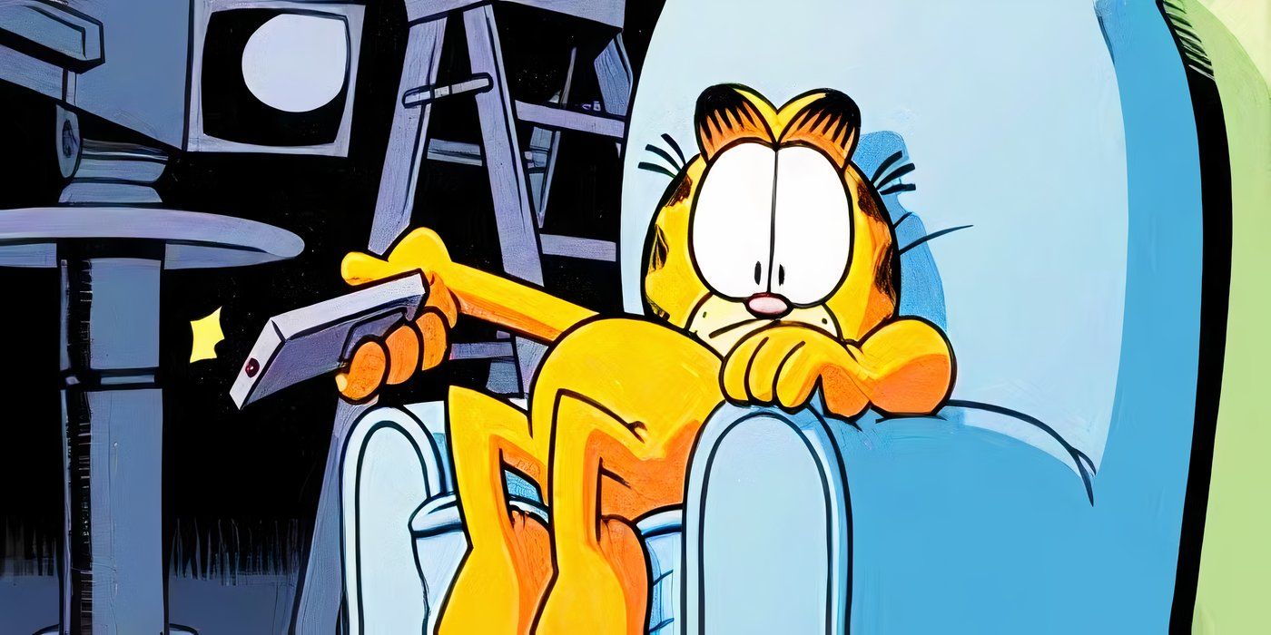 Garfield sitting in a chair watching TV.