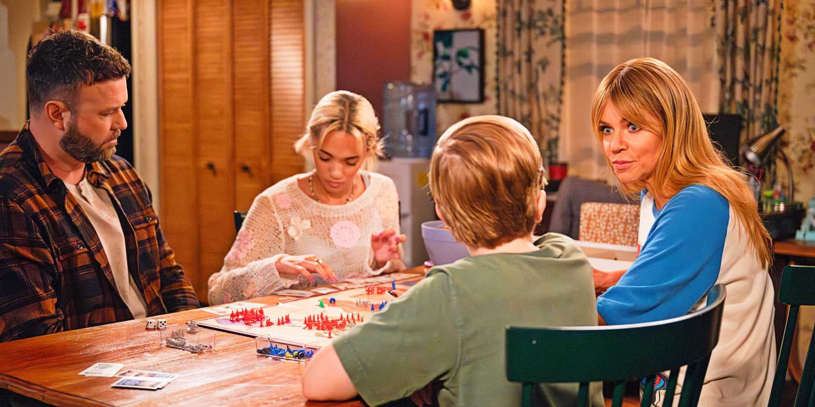 Taran Killam, Amirah J, Matthew Lamb, and Kaitlin Olson as Ludo, Ava, Elliot, and Morgan playing a board game together in High Potential season 1, episode 7 ("One of Us").