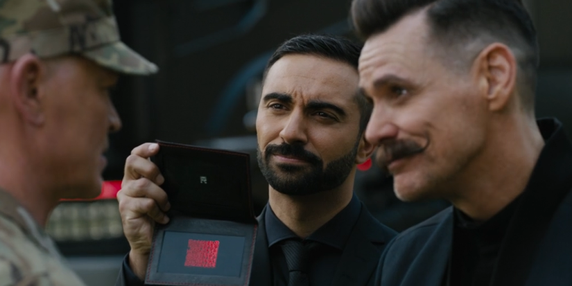 Agent Stone stands with Doctor Robotnik, showing a soldier the doctor's credentials in Sonic the Hedgehog