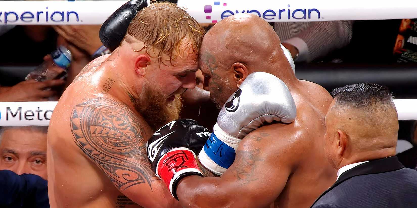 Jake Paul and Mike Tyson embrace each other in the Netflix streamed fight