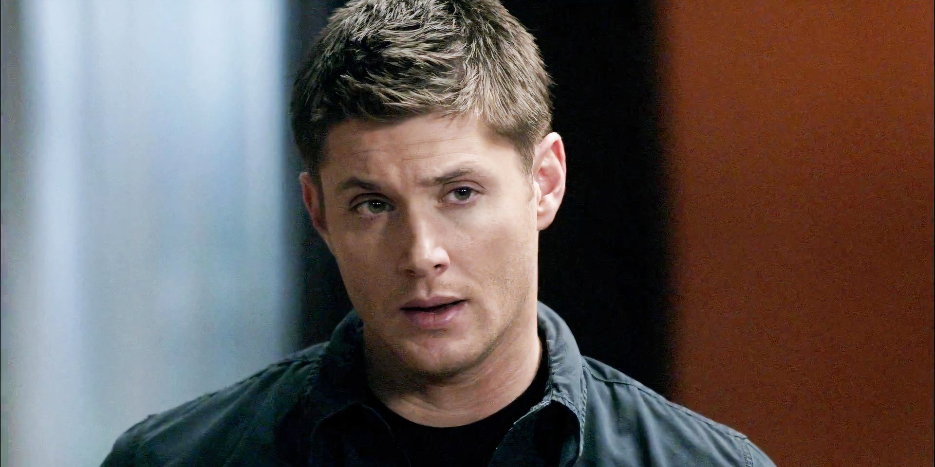 Jensen Ackles as Dean Winchester smirking in Supernatural season 5