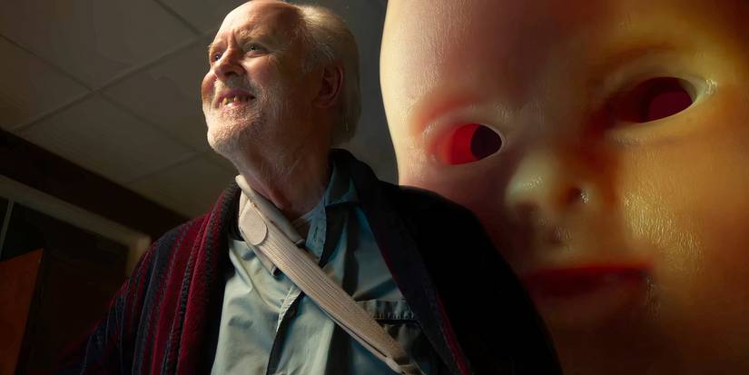 John Lithgow with a giant baby face behind him in The Rule of Jenny Pen