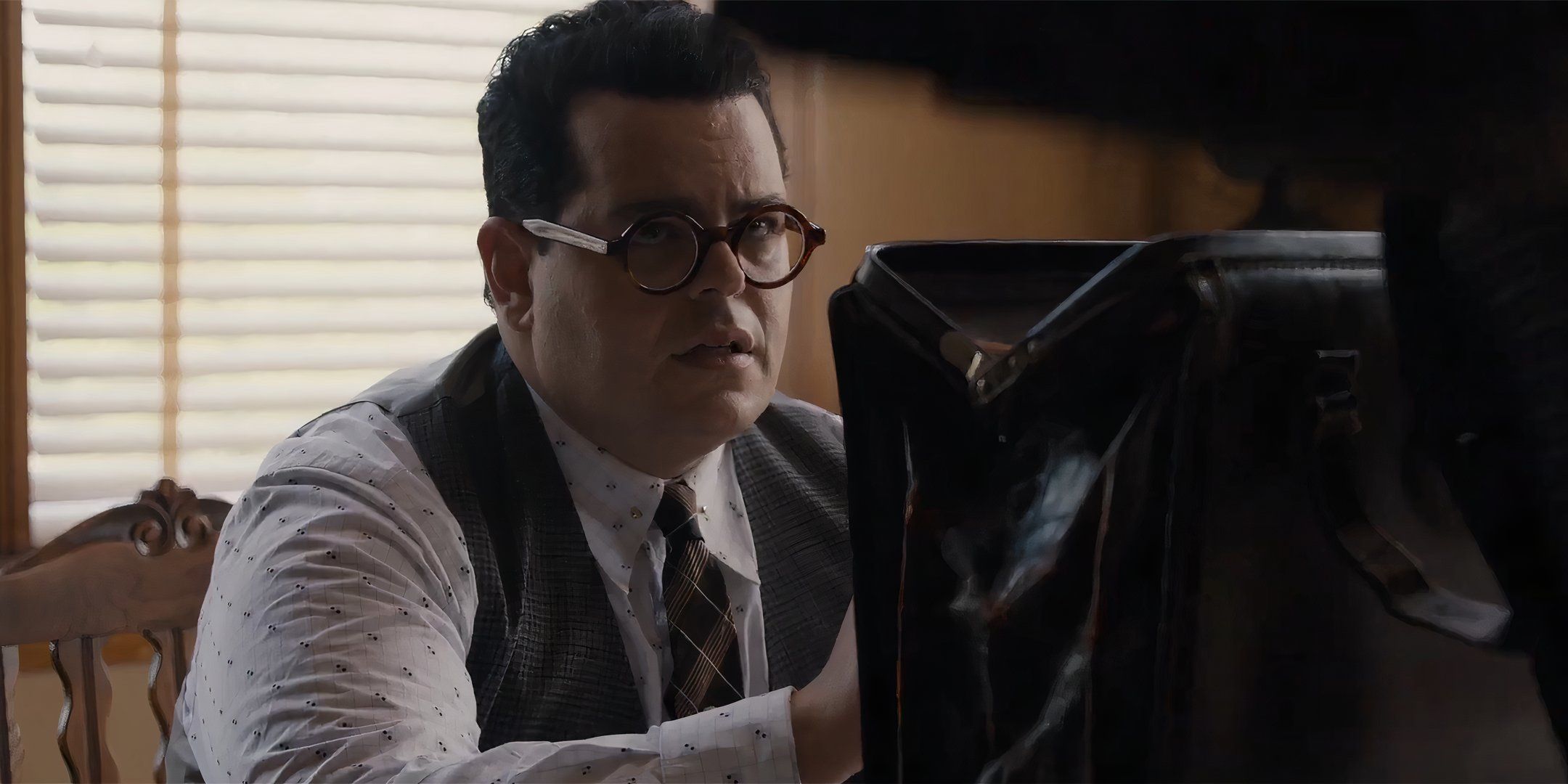 Josh Gad's Sam looking up and worried at Chadwick Boseman's Thurgood in Marshall