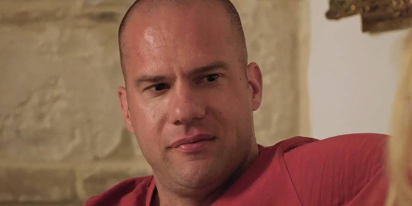 Josko Luketin in 90 Day Fiance in red shirt looking at Vanja