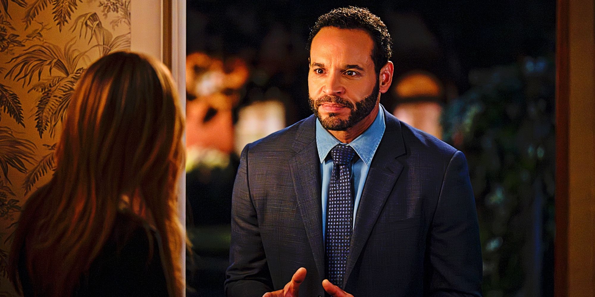 Daniel Sunjata as Detective Adam Karadec stands at Morgan's door in 