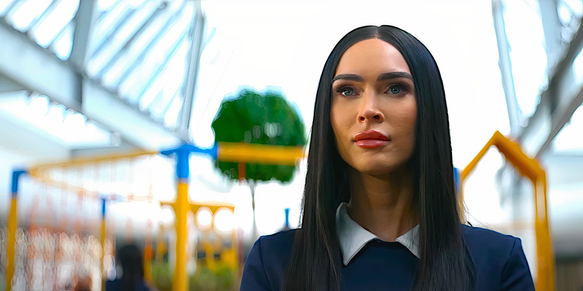 Megan Fox stares ahead blankly in a scene from Subservience