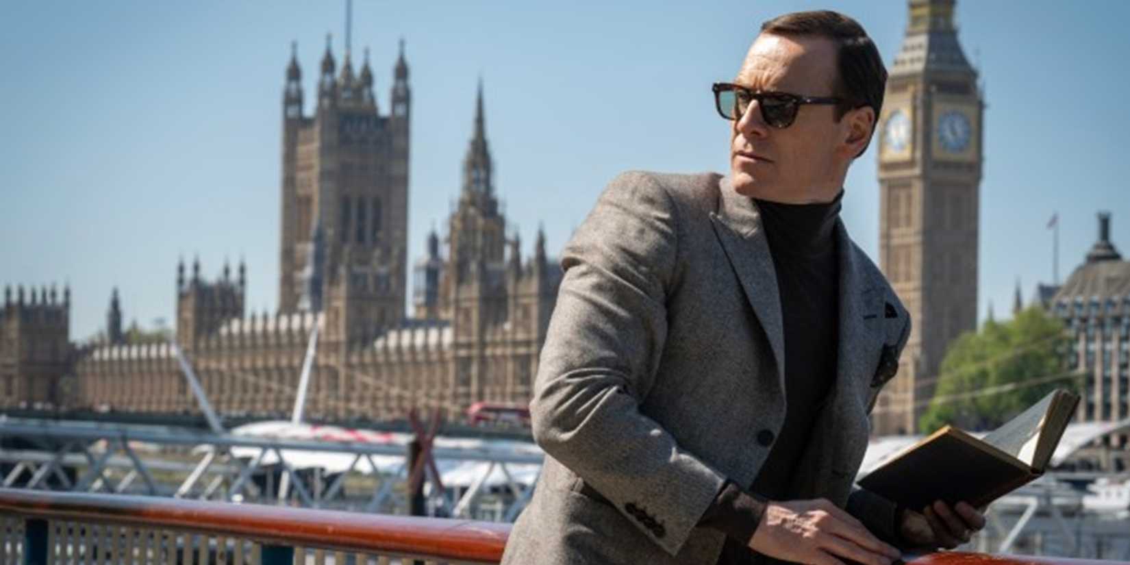 Michael Fassbender reading a book in Black Bag